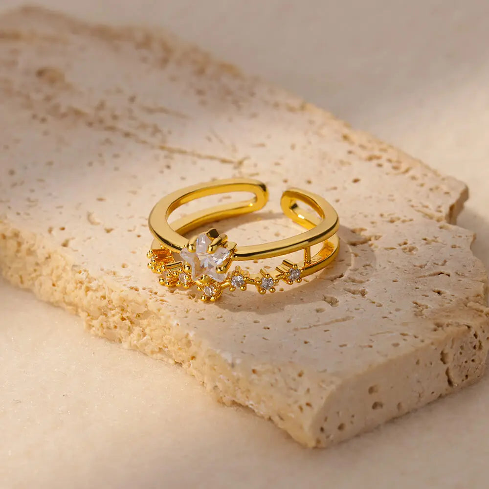 Elegant geometric heart ring with sparkling zircon accents and a luxurious gold-color finish. Made from durable stainless steel, perfect for weddings, everyday wear, or a stylish couple gift.